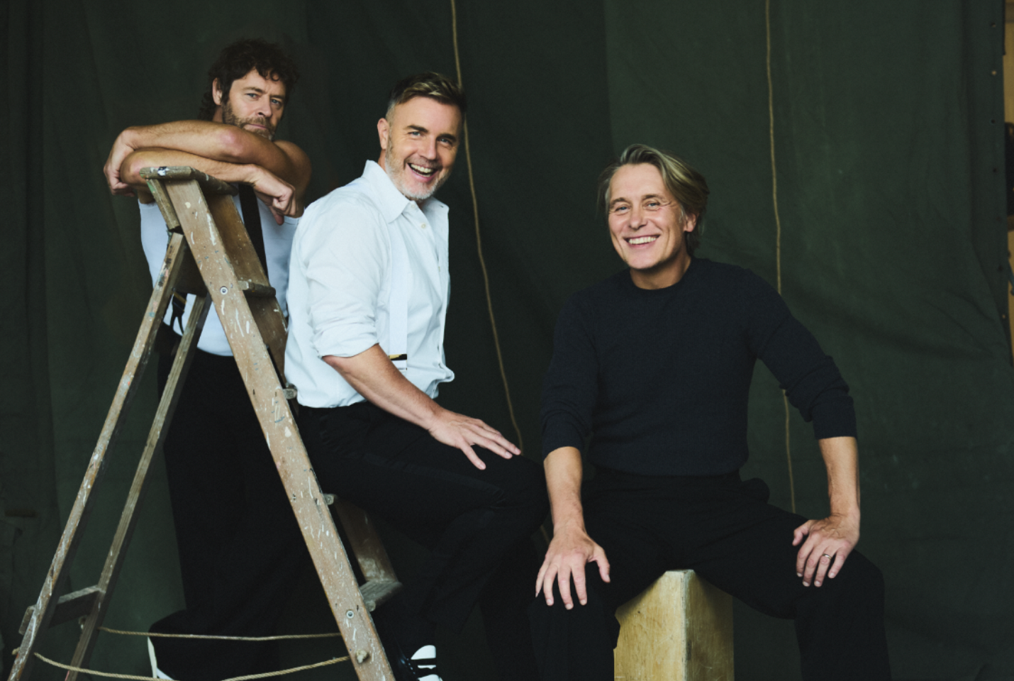 Take That stood on a ladder